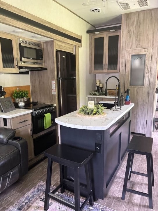 Full kitchen with modern finishes and counter space